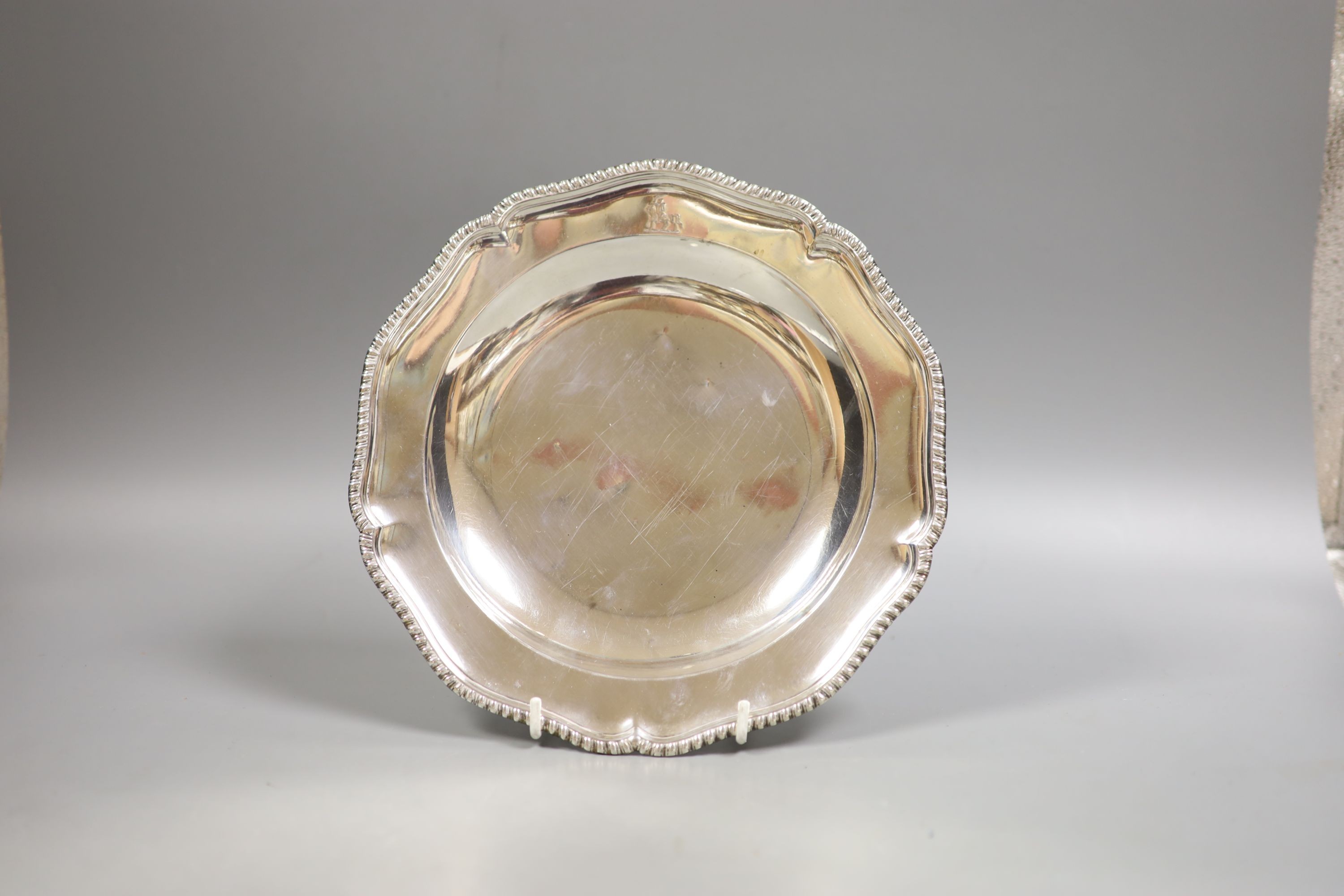 A late George II silver side plate, with gadrooned border, London, 1759, 23.7cm, 12.5oz.